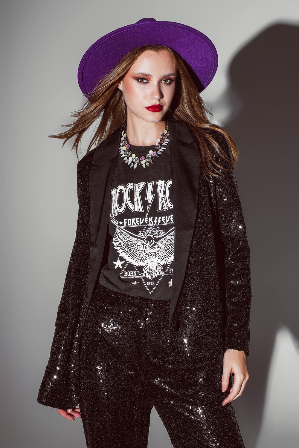 Blazer de lentejuelas negras con solapas de satén