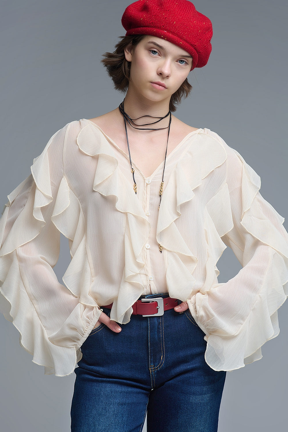 Blusa beige con cuello en V y volante integral