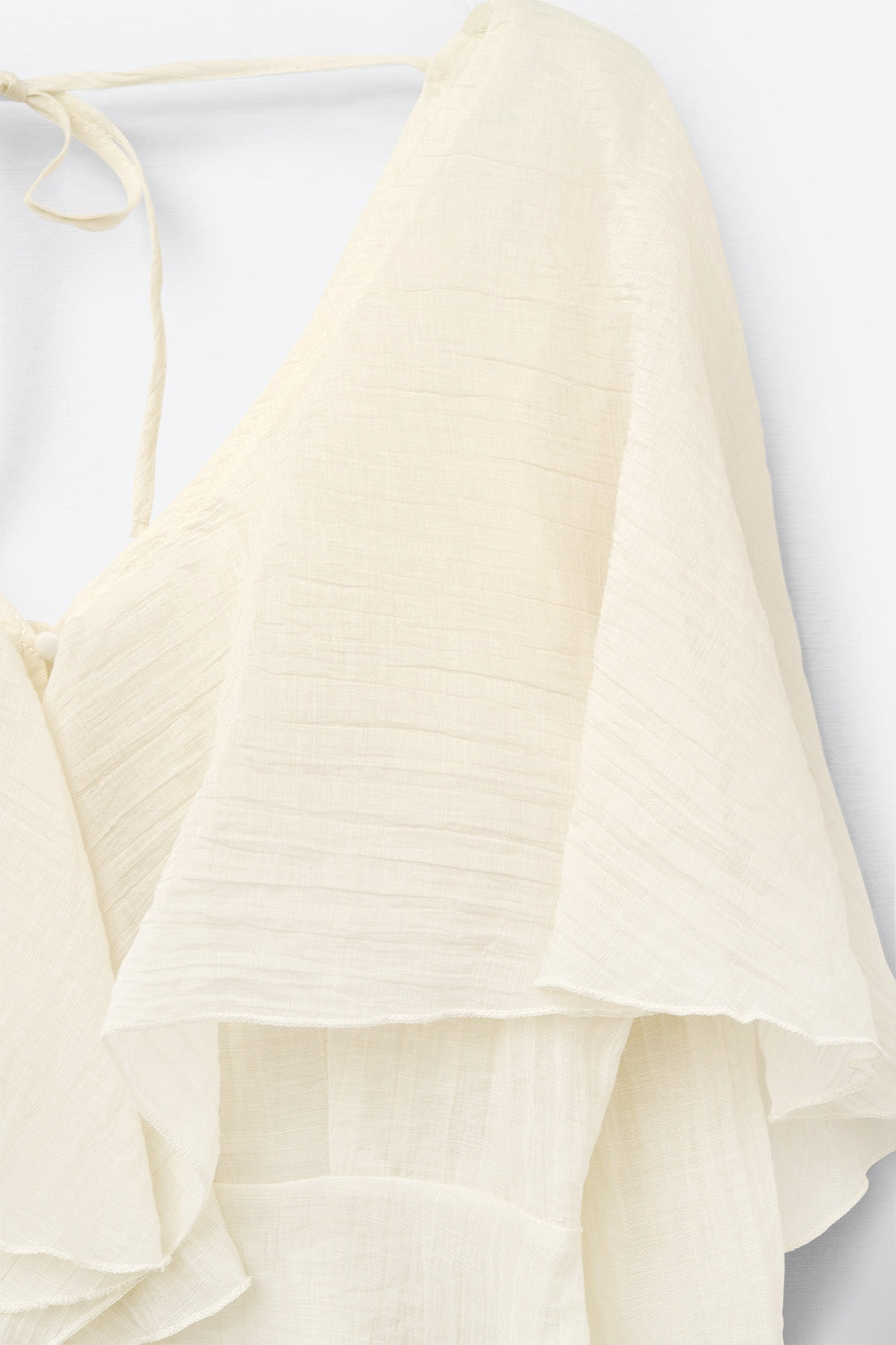 blusa corta de gasa fluida con mangas largas