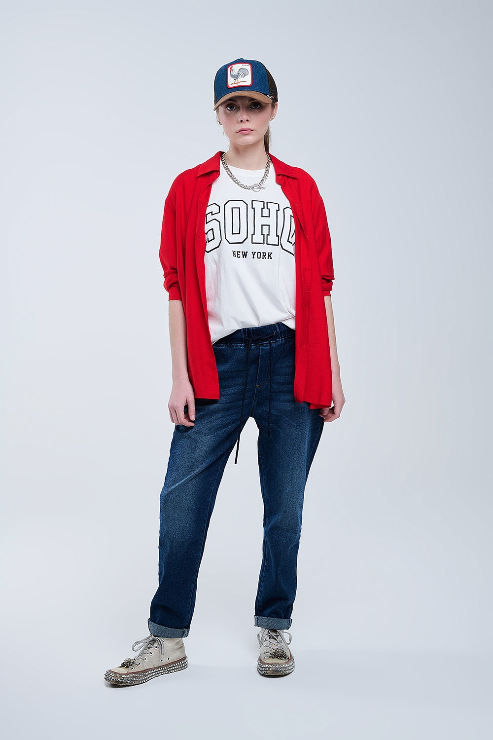 Camisa oversize de color rojo vibrante con cuello polo y manga tres cuartos para mujer en Ivoluxt.