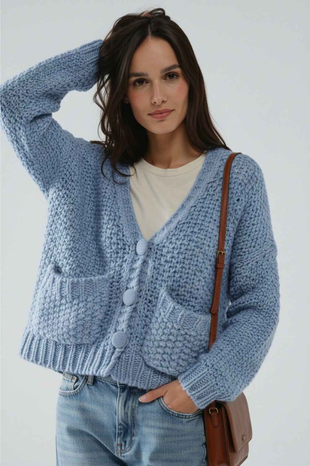 Chaqueta oversize de punto grueso azul claro con bolsillos