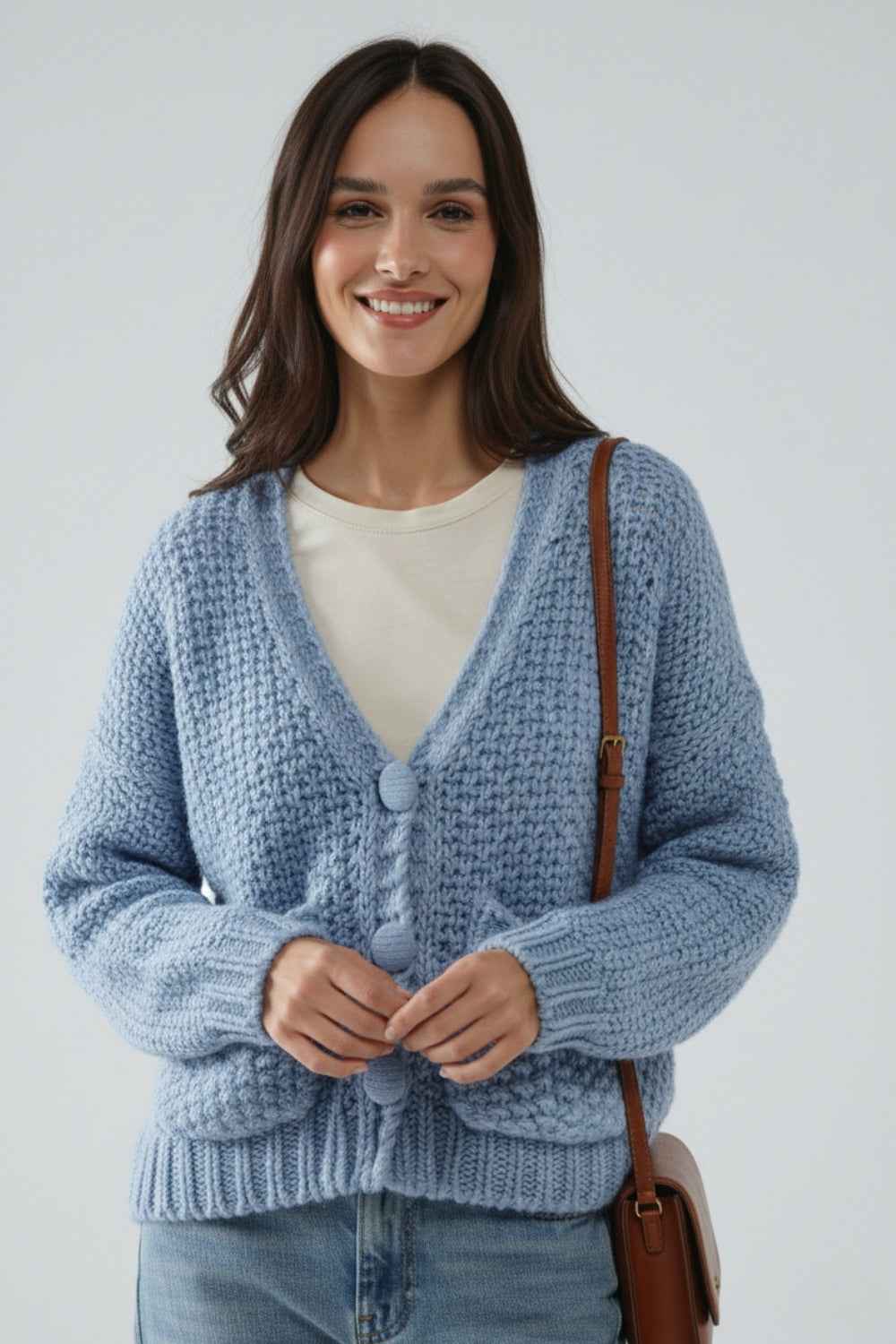 Chaqueta oversize de punto grueso azul claro con bolsillos