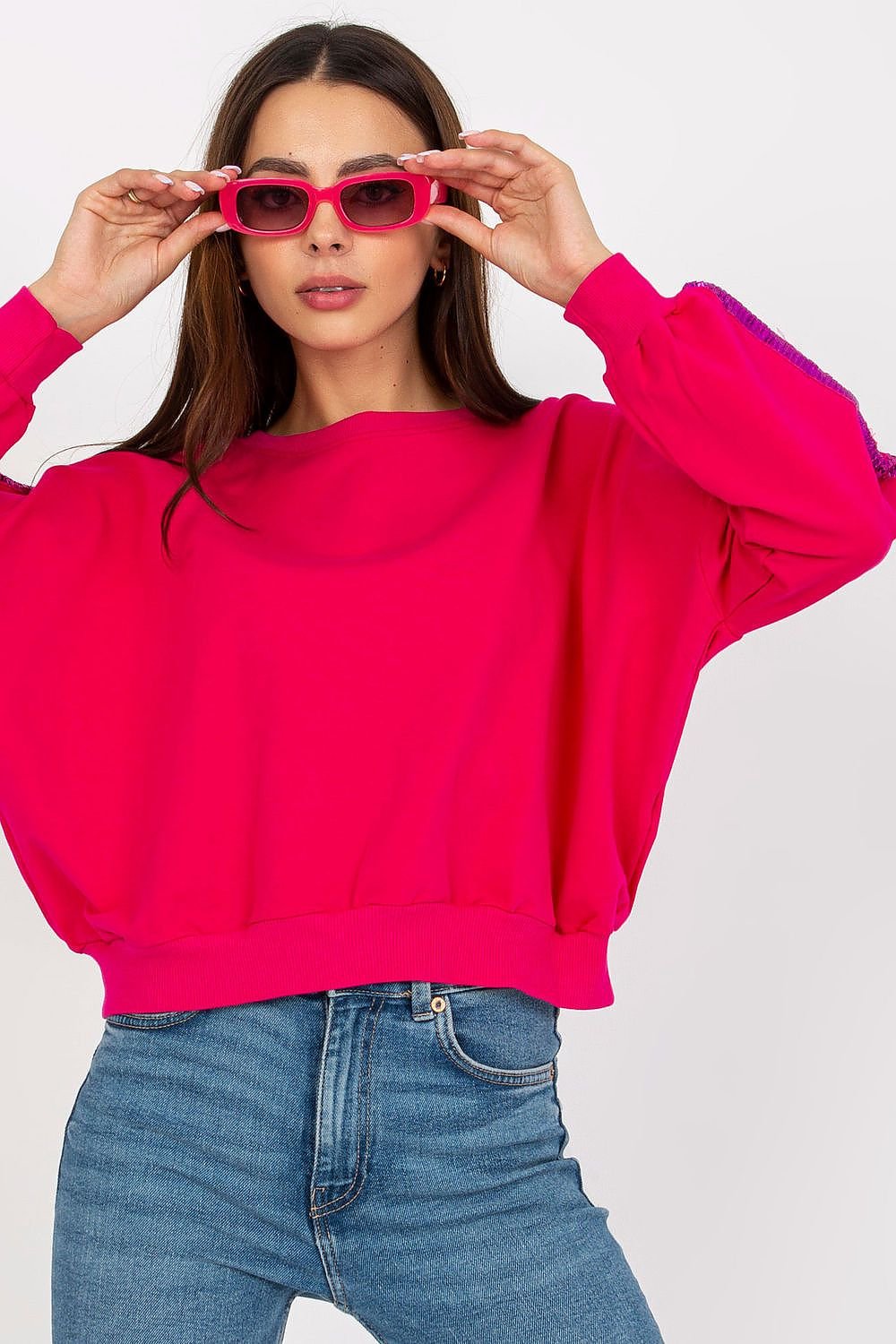 Sudadera en color Fucsia con detalle de lentejuelas en mangas - Elegancia casual