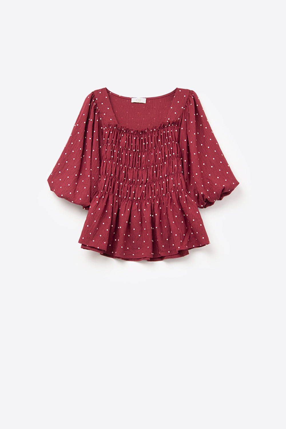 Elegante top rojo de lunares ajustado a la cintura