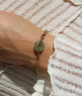 Pulsera Paloma dorada con anillo de jade