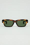 Gafas de sol color ámbar con lentes ovaladas de color verde oscuro