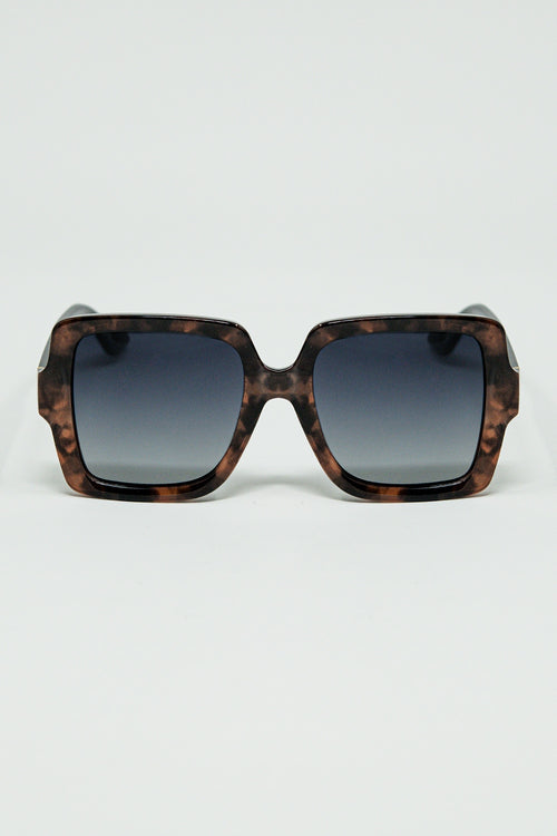 Gafas de sol con montura estampada marrón y patillas negras