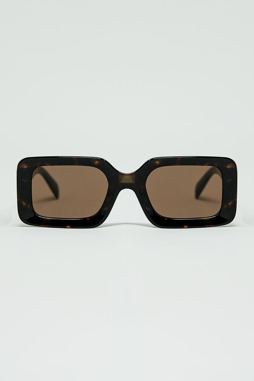 gafas de sol cuadradas marrones con estampado animal verde en el lateral