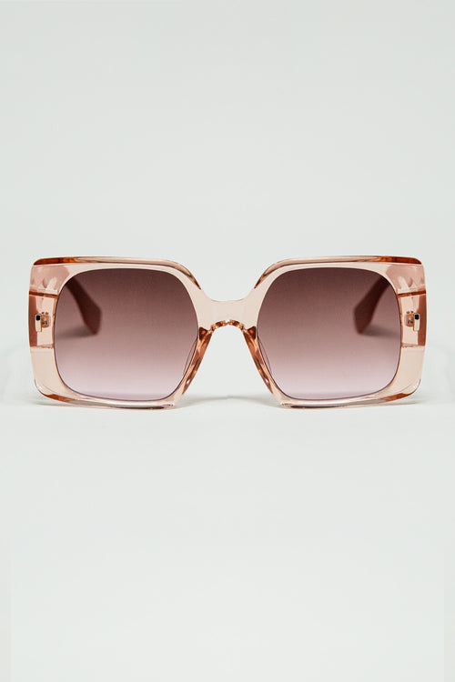 Gafas de sol cuadradas rosas con detalle dorado en el lateral