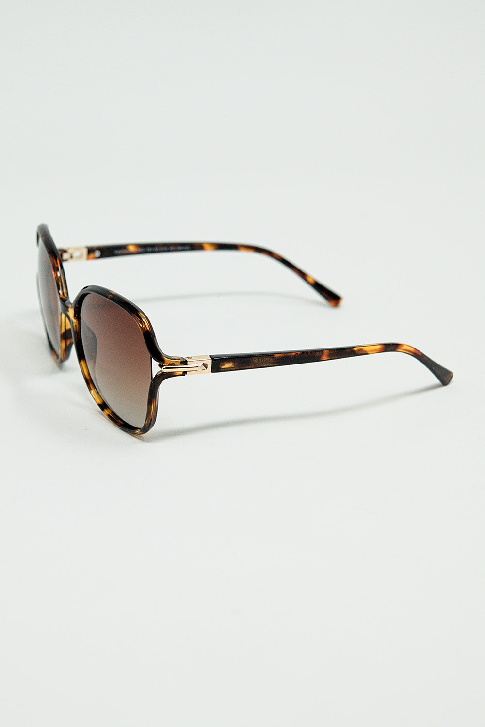Gafas de sol redondas con estampado beige y detalle metálico dorado