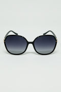 Gafas de sol redondas en negro con detalle metálico dorado