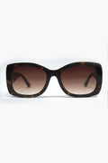 Gafas de sol ovaladas oversize con montura carey y cristales marrones degradados vista frontal.