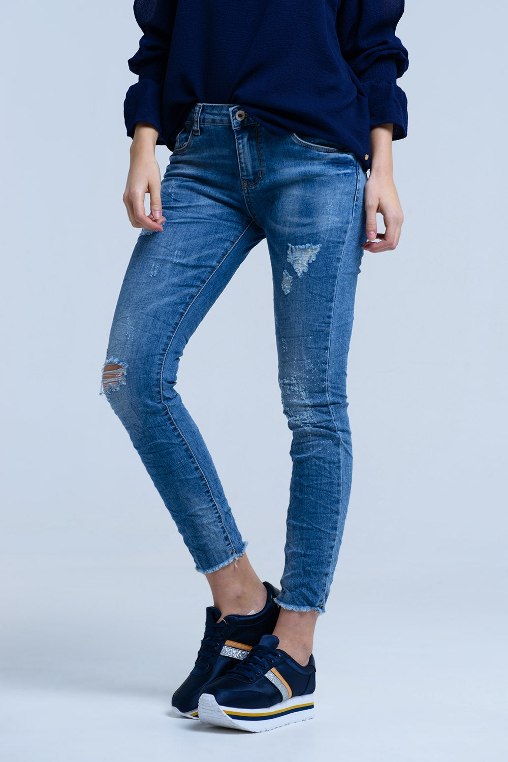 Jeans con detalle de roturas