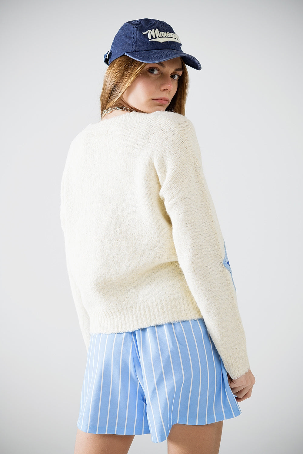 Jersey crema con estrellas bordadas