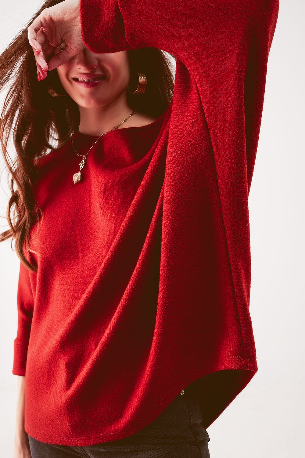 Jersey cuello barco con mangas de murciélago en naranja rojizo