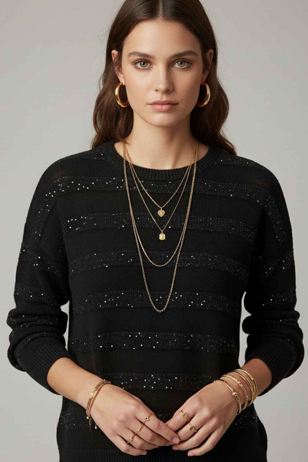 Jersey de punto a rayas negro con detalle de lentejuelas