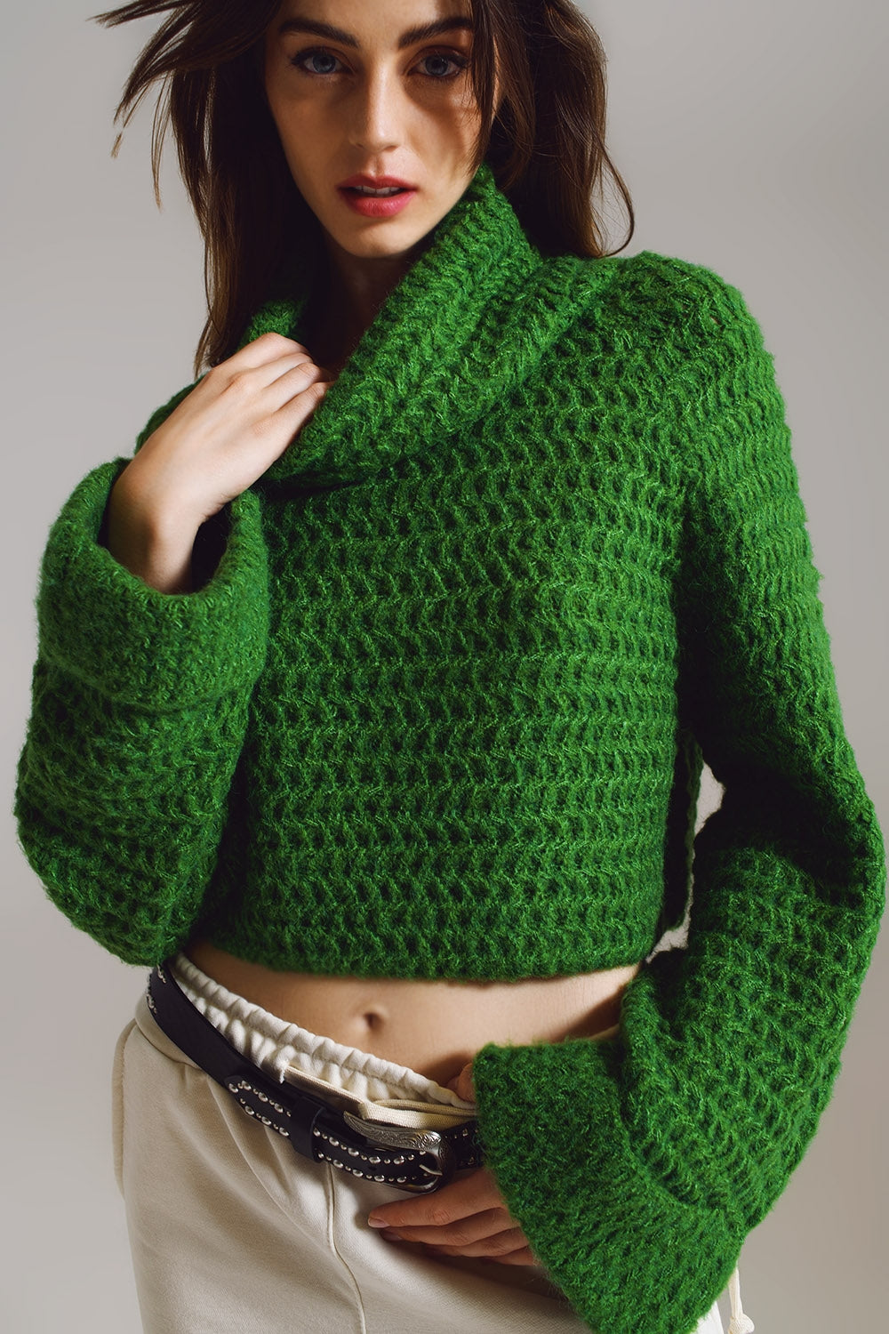 Jersey de punto de gofre con cuello de tortuga y puños enrollados en verde