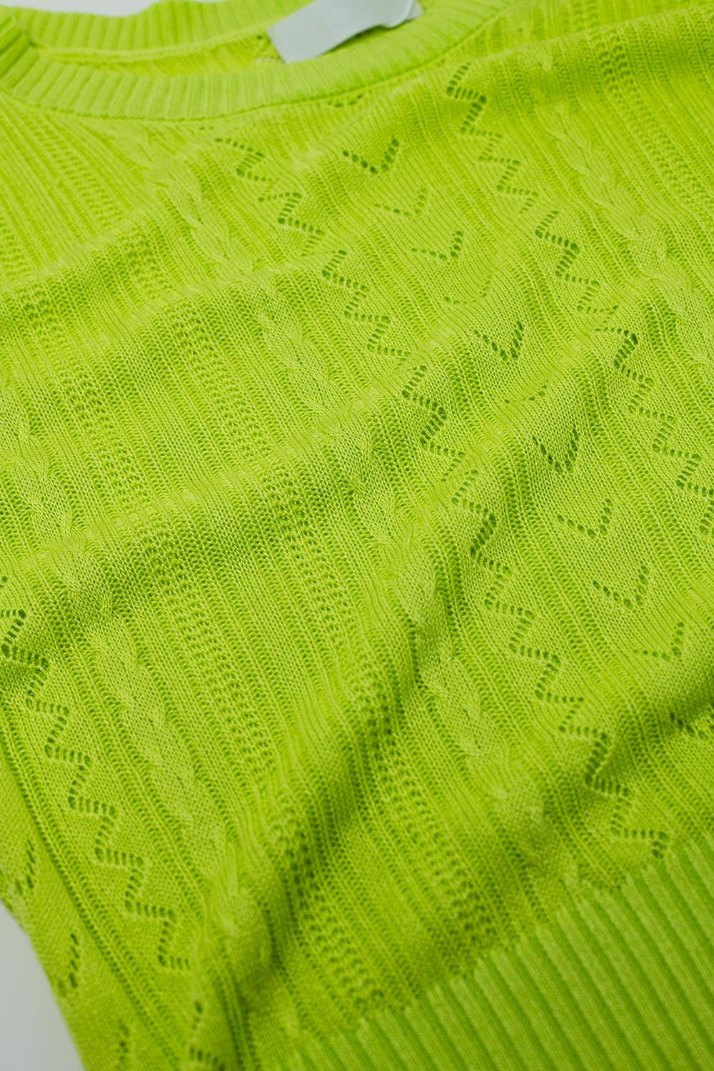 jersey de punto verde de manga 3/4 con detalles de rayas en zig zag