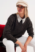 Jersey en color negro jaspeado de cuello redondo