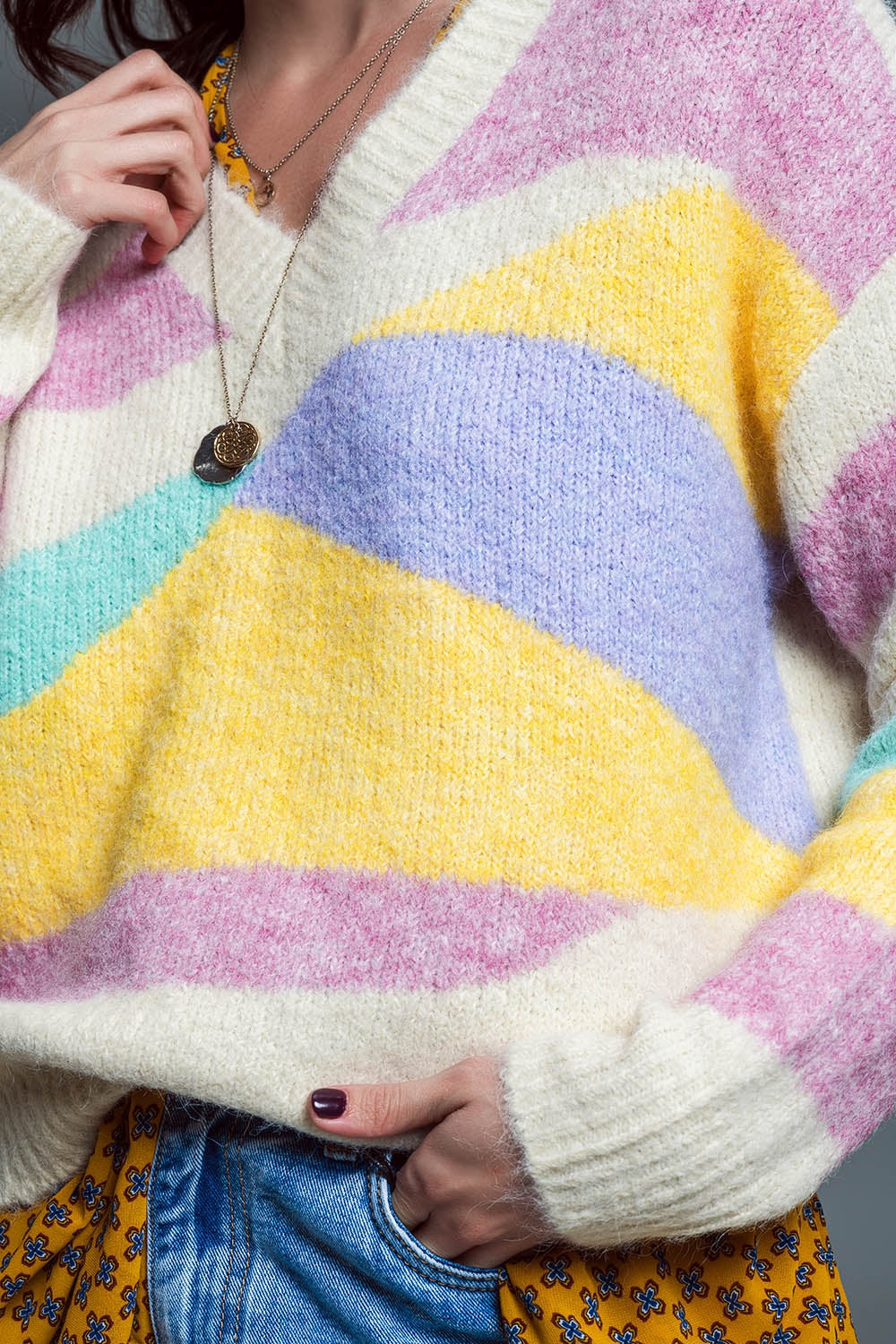 Jersey relajado de pico beige con rayas pastel