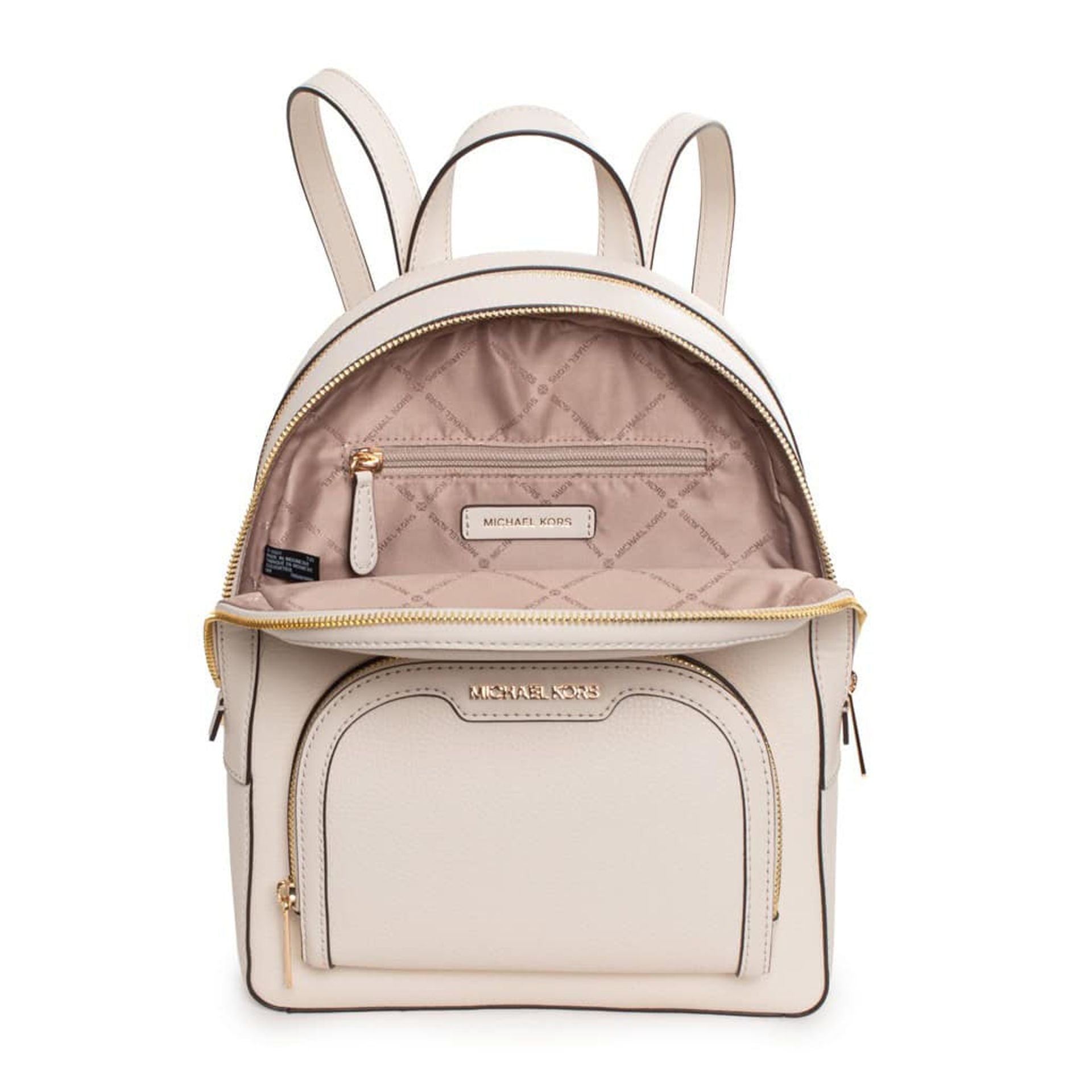 Interior de mochila Michael Kors beige claro con forro y bolsillo interior.