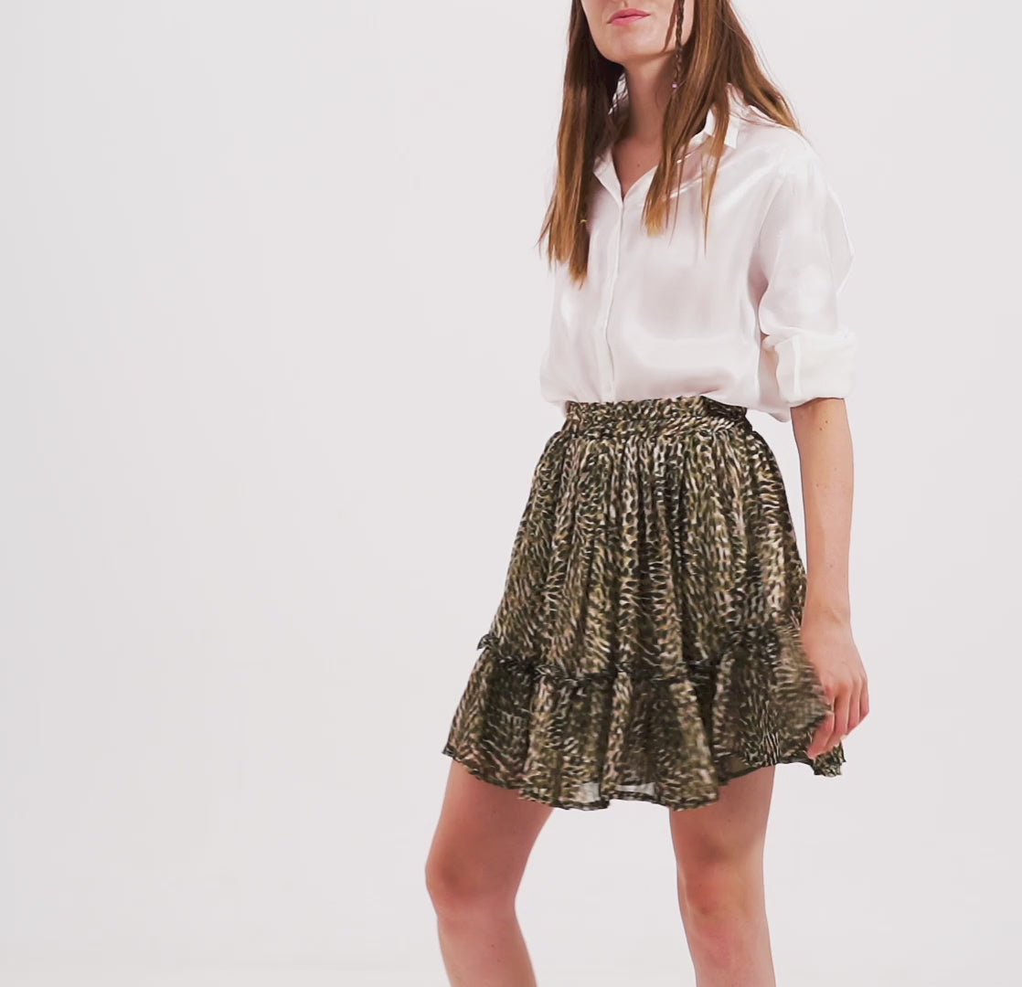 Mini falda de gasa verde con cintura elastica y tejido brillante