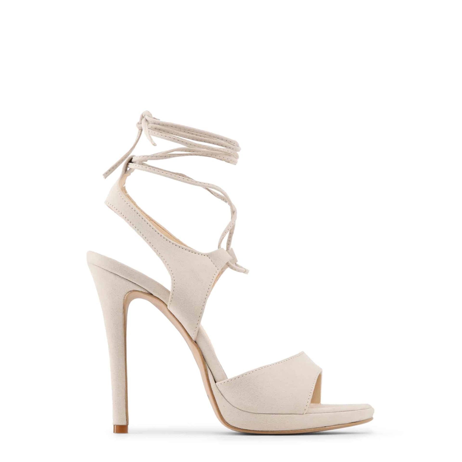 Vista lateral de sandalias beige elegantes Made in Italy