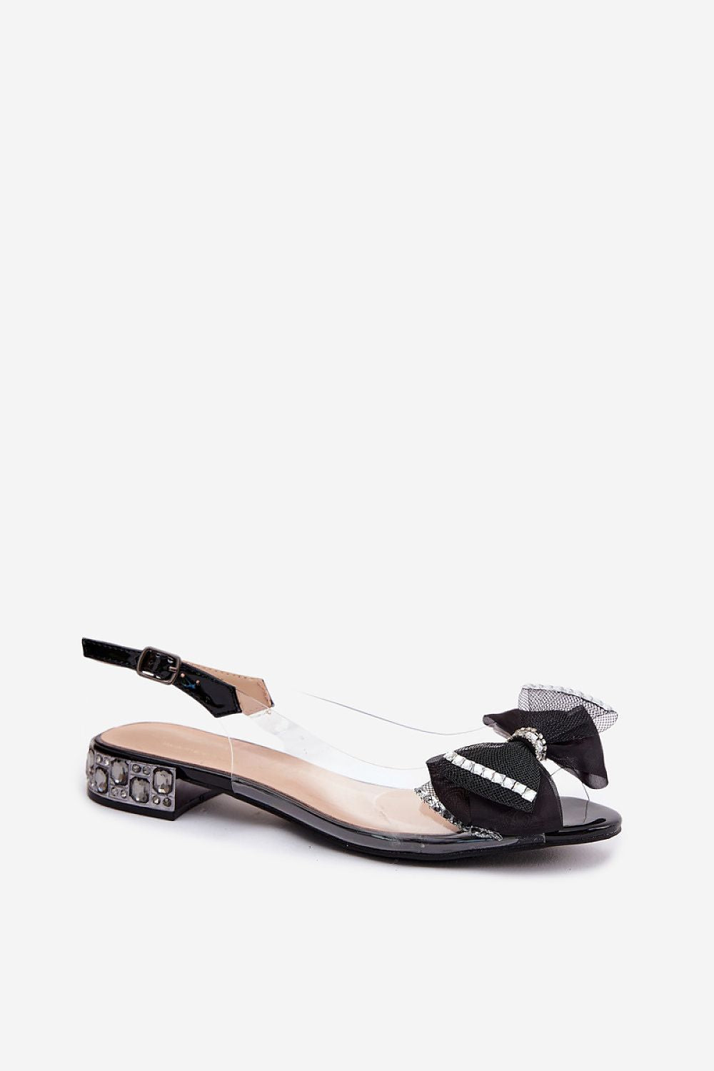Sandalias transparentes bajas con lazo negro de pedrería y tacón joya