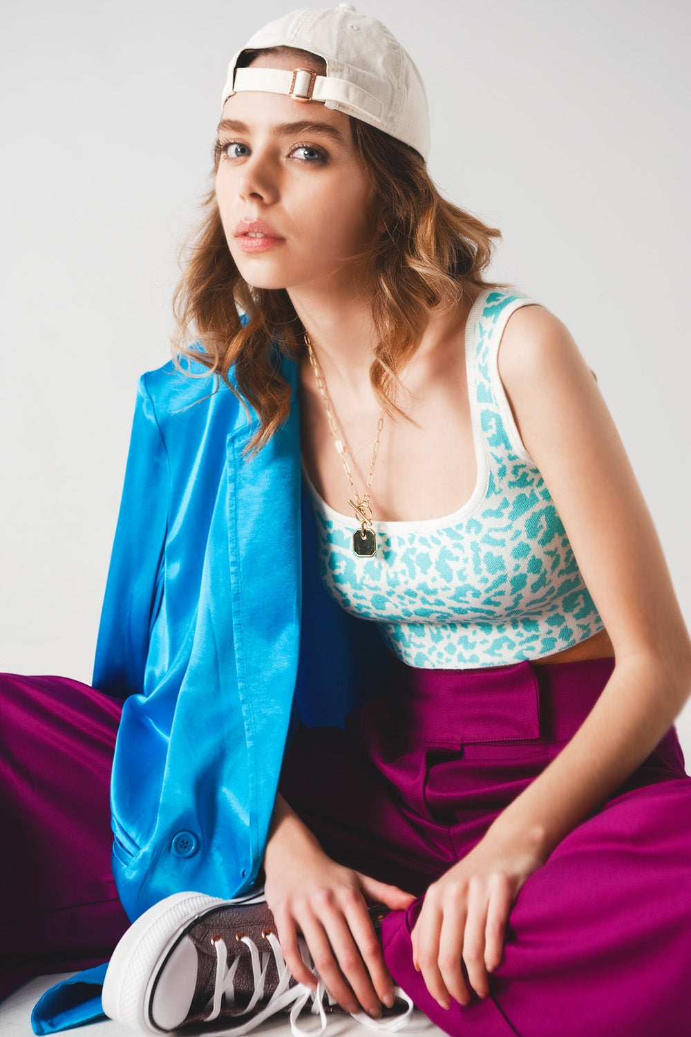 Top punto ligero en estampado animal turquesa