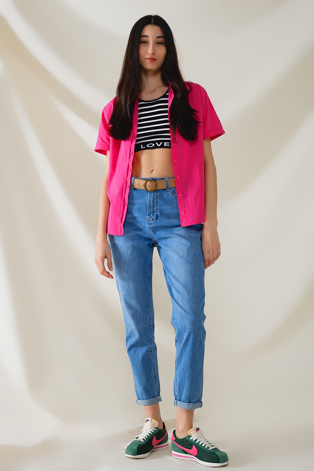 Vaqueros de cintura alta en denim elástico de lavado medio