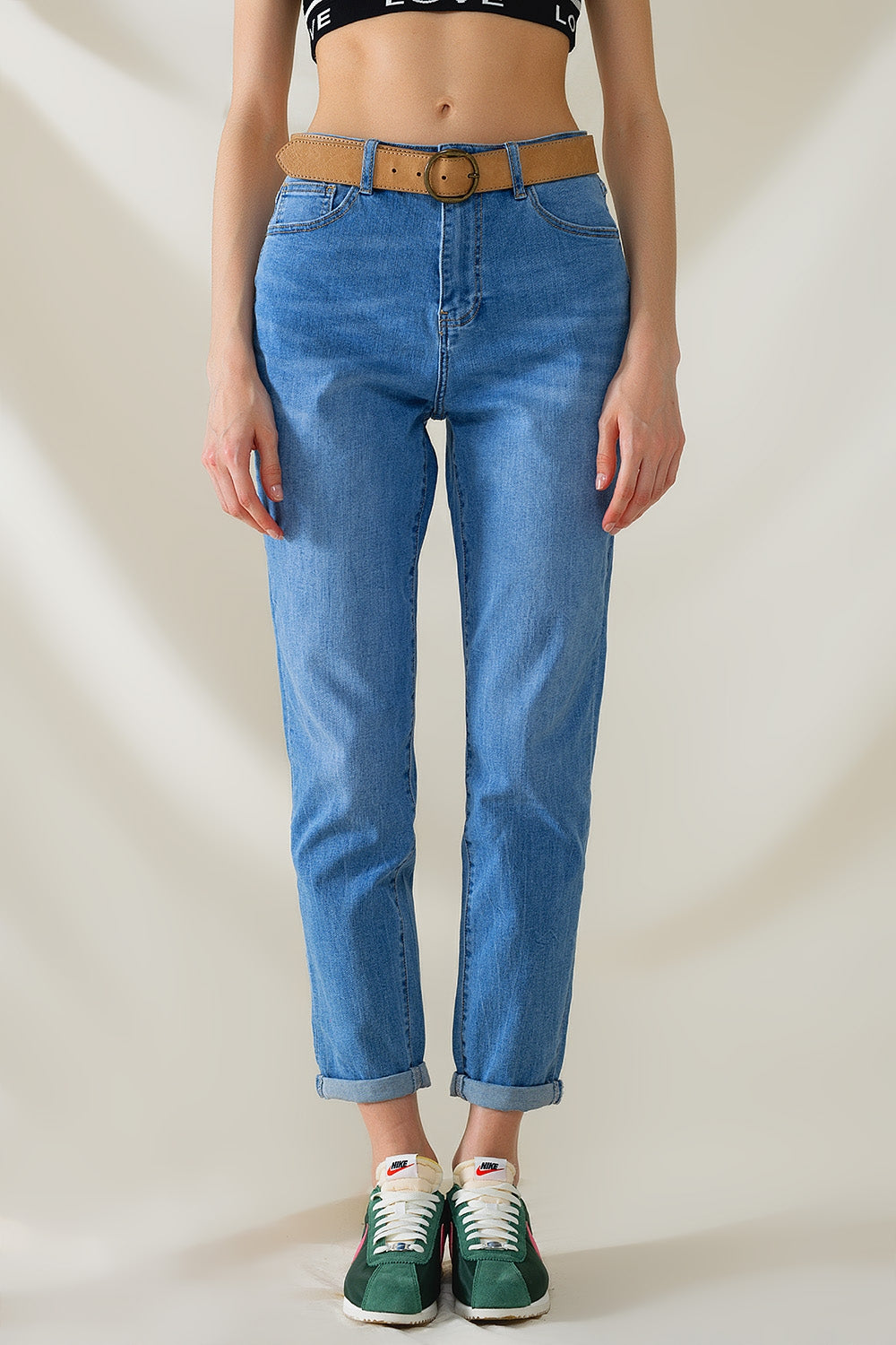 Vaqueros de cintura alta en denim elástico de lavado medio
