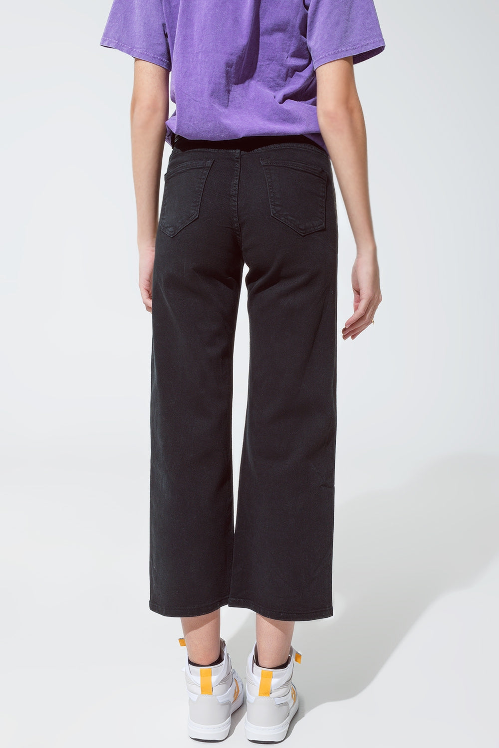 Vaqueros negros de pierna recta con brillo metálico dorado